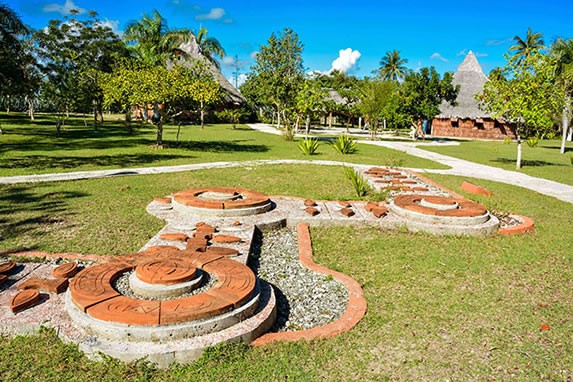 garden with cement figures on the lawn