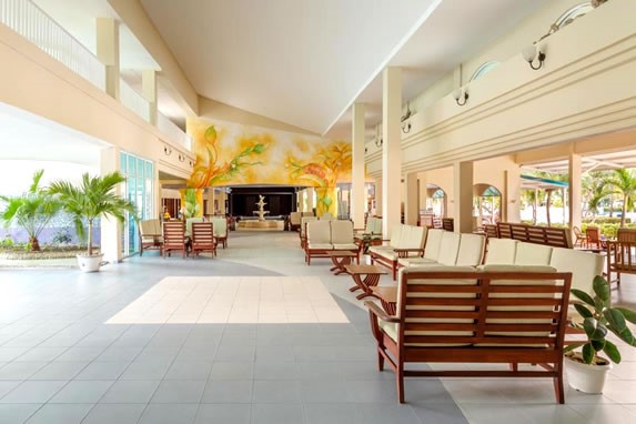 lobby with wooden furniture and plants