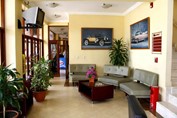 lobby with plants and decorative pictures