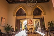 lobby with wooden armchairs and paintings