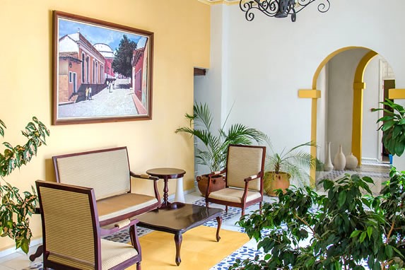 lobby with wicker furniture and plants