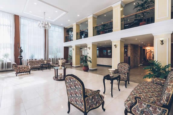 lobby with antique furniture and large windows