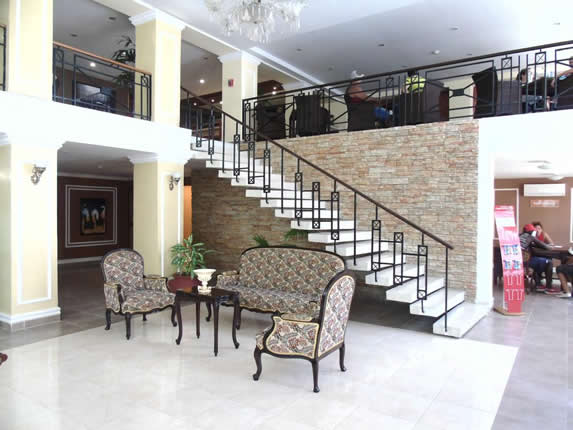 lobby with antique furniture and large windows