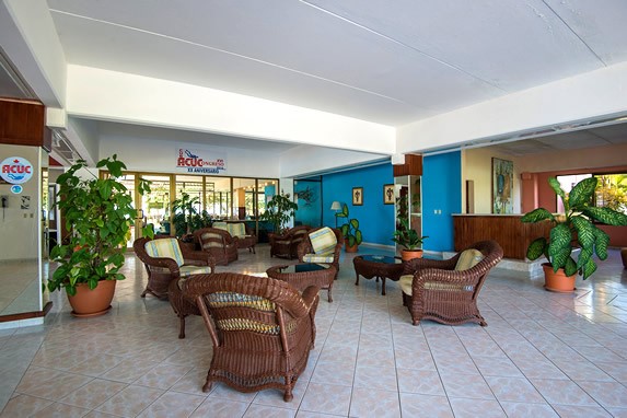 lobby with wicker furniture and plants
