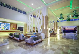 lobby with reception desk and gray furniture