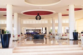 lobby with furniture and marble floor