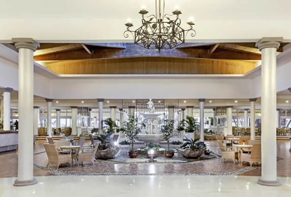 lobby with wooden ceiling and fountain in the cent