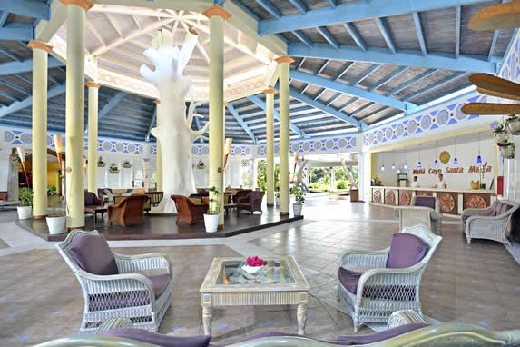 spacious lobby with wooden ceiling and furniture