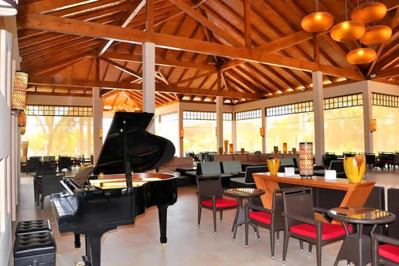 wooden-roofed lobby with grand piano 