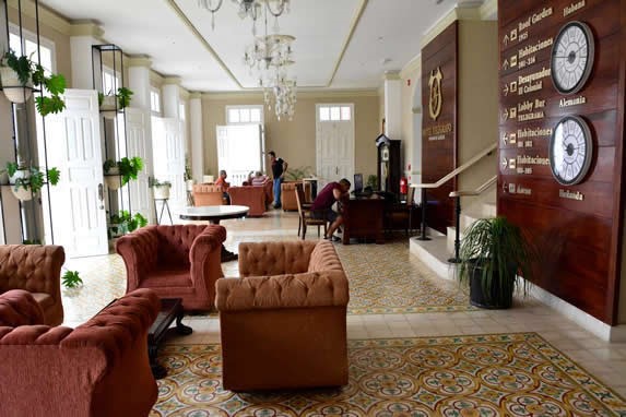 hotel lobby with sofas and plants inside