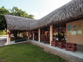 facade of the open lobby with guano roof