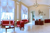 lobby with red furniture and reception desk