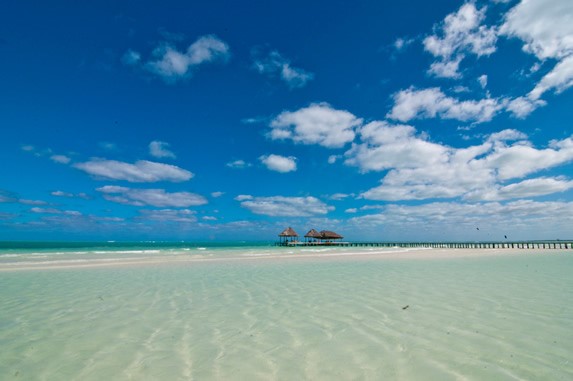 beach with crystal clear waters and golden sand