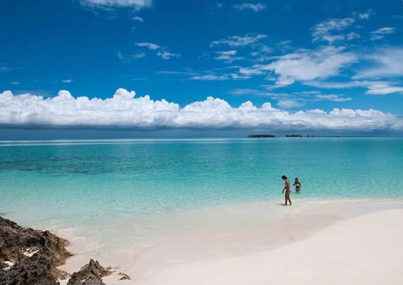 beach with crystal clear waters and golden sands