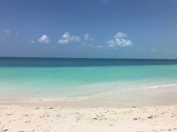 sea of blue waters and white sands