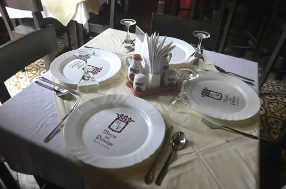 restaurant table set with tablecloths