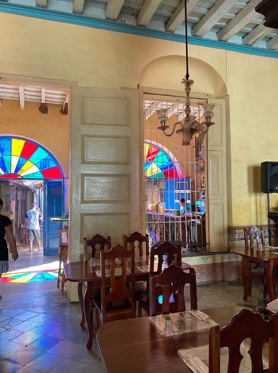 wooden tables and colorful stained glass 