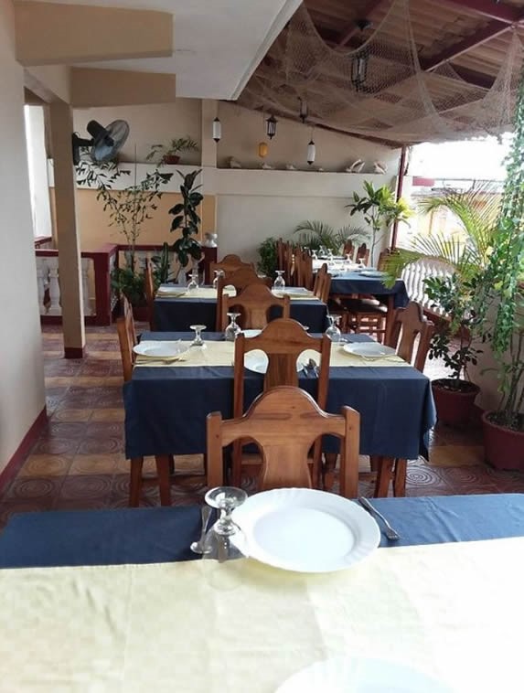 covered terrace with wooden furniture