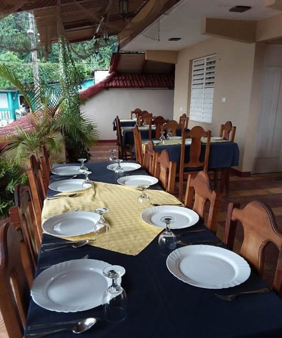 covered terrace with wooden furniture