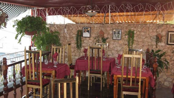 wooden furniture in covered terrace.