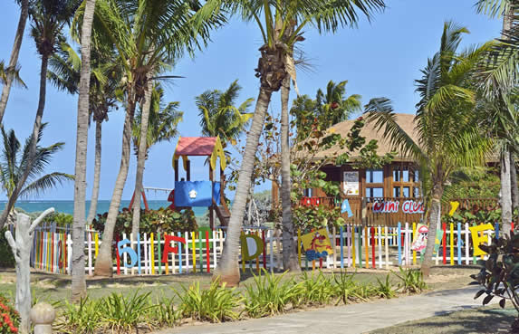 colorful playground surrounded by palm trees