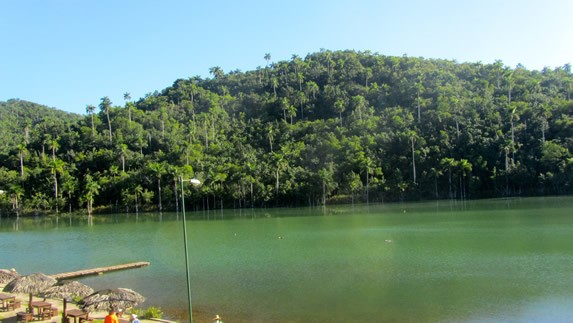 lagoon surrounded by mountains and vegetation