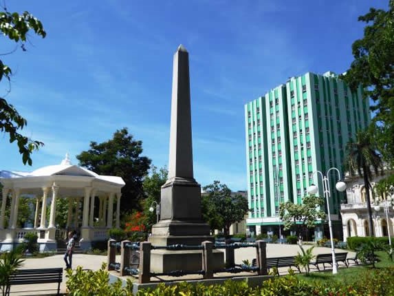 monument in a park surrounded by greenery