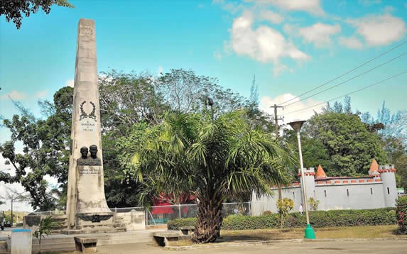 stone monument with bronze sculptures