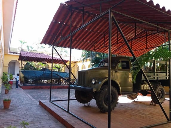 Old military truck and ship exposed.