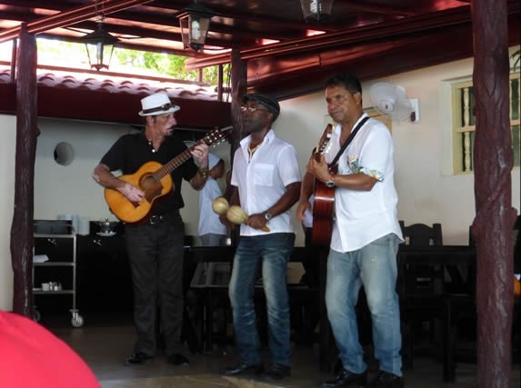 musicians playing under wooden roof