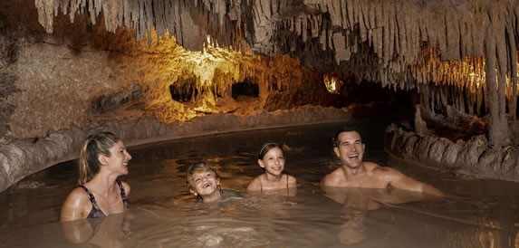 Tourists bathing in the park's cenotes