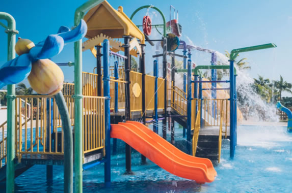 Swimming pool with children's playground at the ho