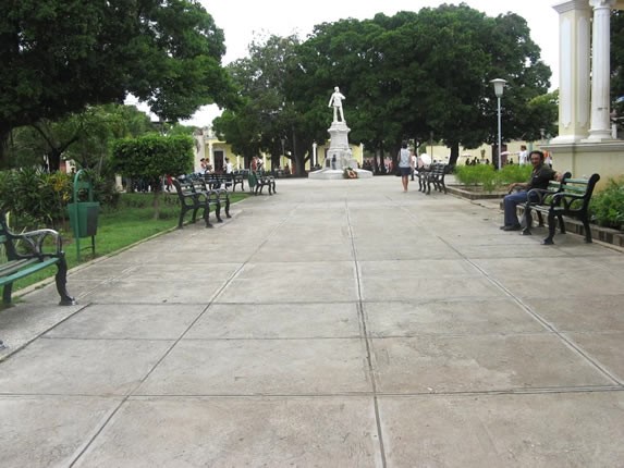 square with benches and leafy trees