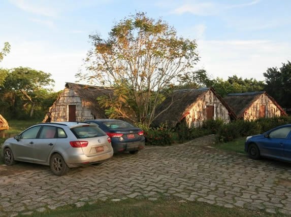 parking surrounded by guano huts