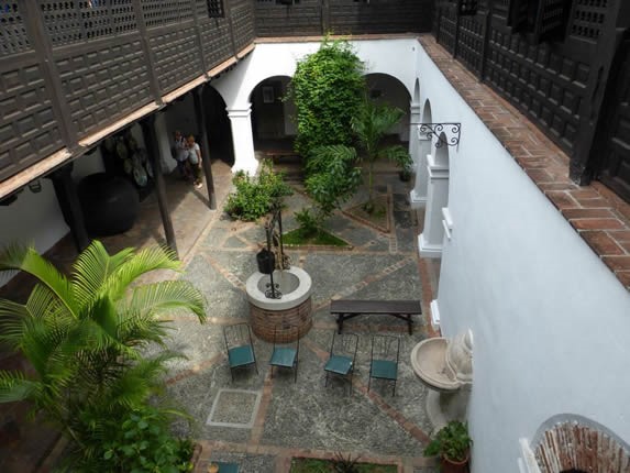 view of the inner courtyard with well and vegetati