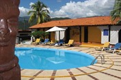 pool surrounded by sun loungers and umbrellas