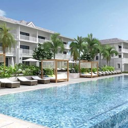 pool surrounded by sun loungers and palm trees