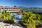 aerial view of pool and lagoon with mountains