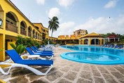 pool surrounded by blue loungers