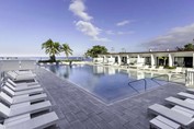 pool with loungers and ocean views