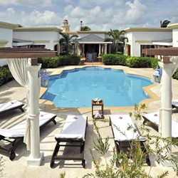 small secluded pool with loungers