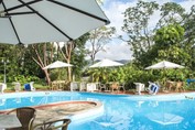 pool with umbrellas and furniture around