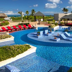 pool with red loungers around