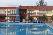 pool surrounded by sun loungers