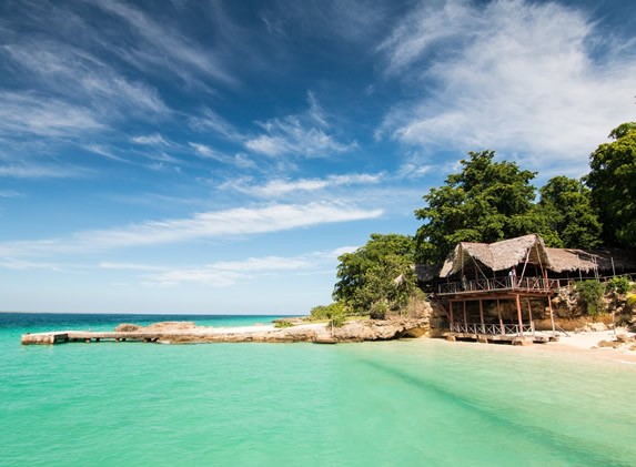 coast with dock and construction of wood and guano