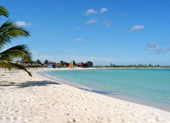 deserted beach with golden sands and blue waters