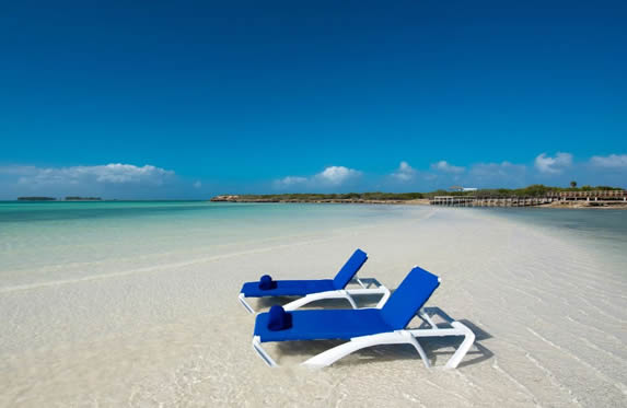 sun loungers on the shore of the deserted beach