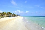 blue water beach and golden sands