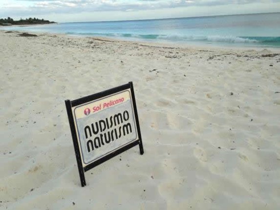 beach with sign in the sand