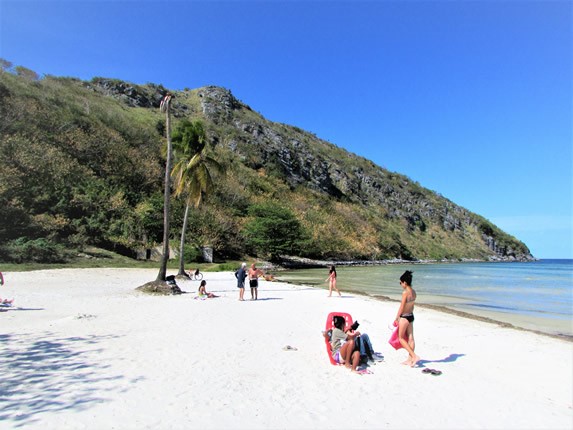 beach with mountain in the background